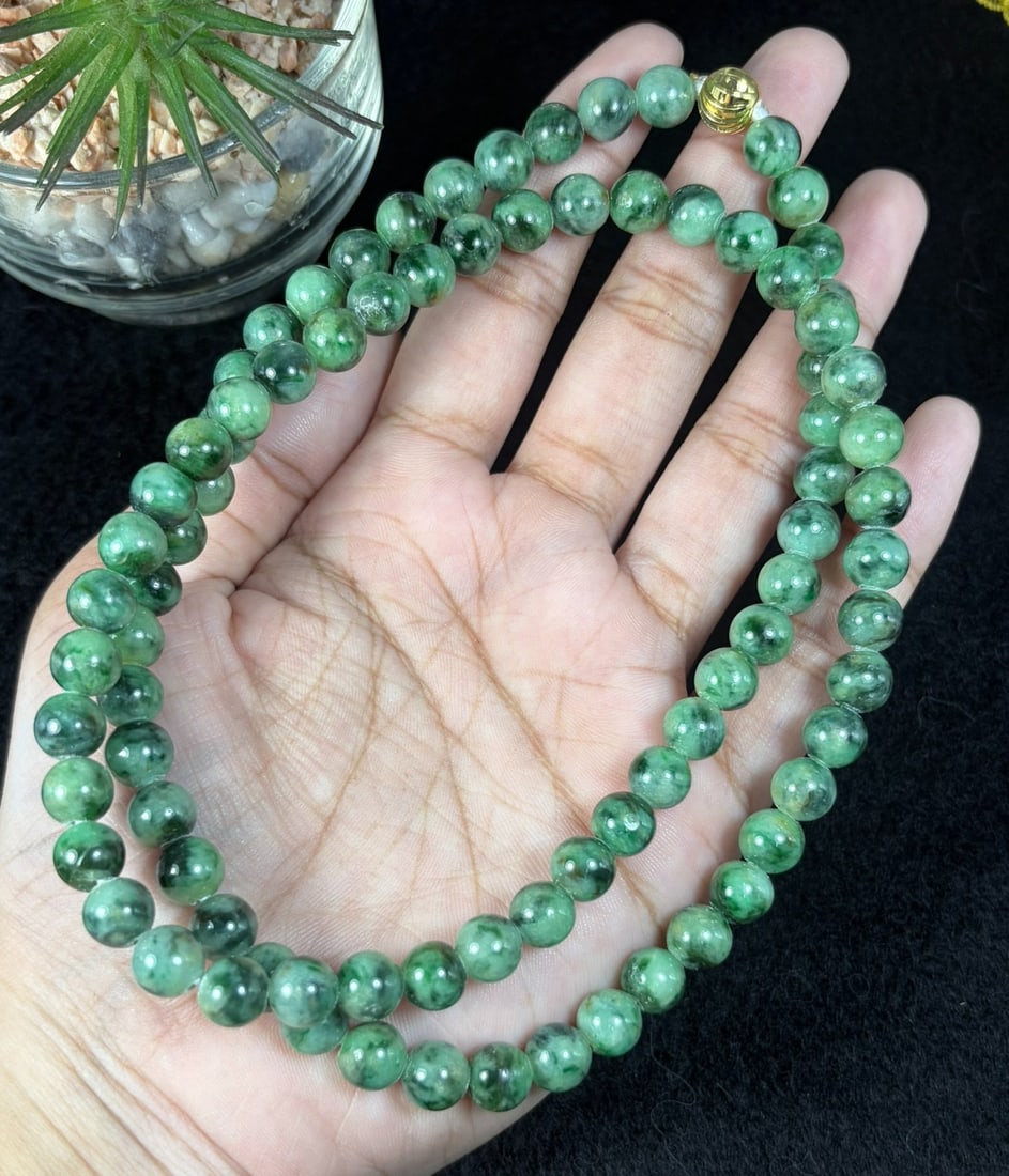 Natural Burmese Type A Dark Floating Green Jadeite Beaded Necklace, 25YM: Hand-strung natural Burmese Type A jadeite round beads with rich deep green mossy floating inclusions throughout each polished bead. Every sphere features natural marbled green veining against a pale 