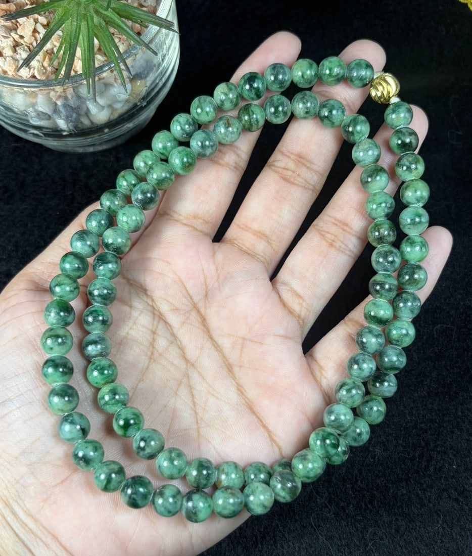Natural Burmese Type A Dark Floating Green Jadeite Beaded Necklace, 20YM: Hand-strung natural Burmese Type A jadeite round beads with rich deep green mossy floating inclusions throughout each polished bead. Every sphere features natural marbled green veining against a pale 