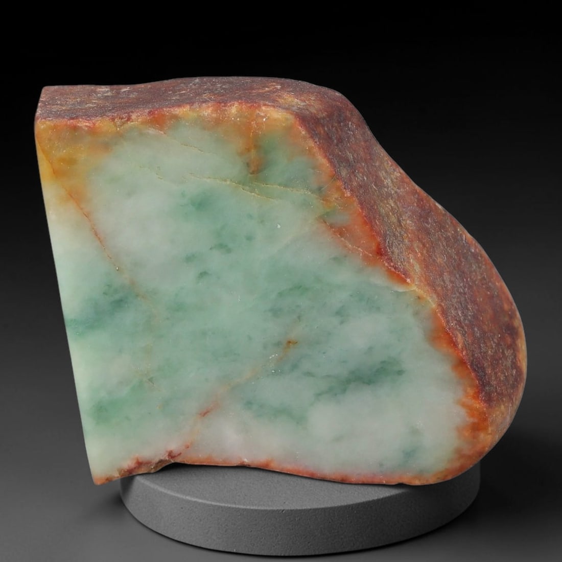 450ct Natural Type A Burmese Jadeite Jade Sliced Rough, 62AZ: This specimen is a sliced rough block of natural Type A Burmese jadeite jade. The interior displays natural colour zoning with visible mineral veining and crystalline patterns typical of unprocessed j