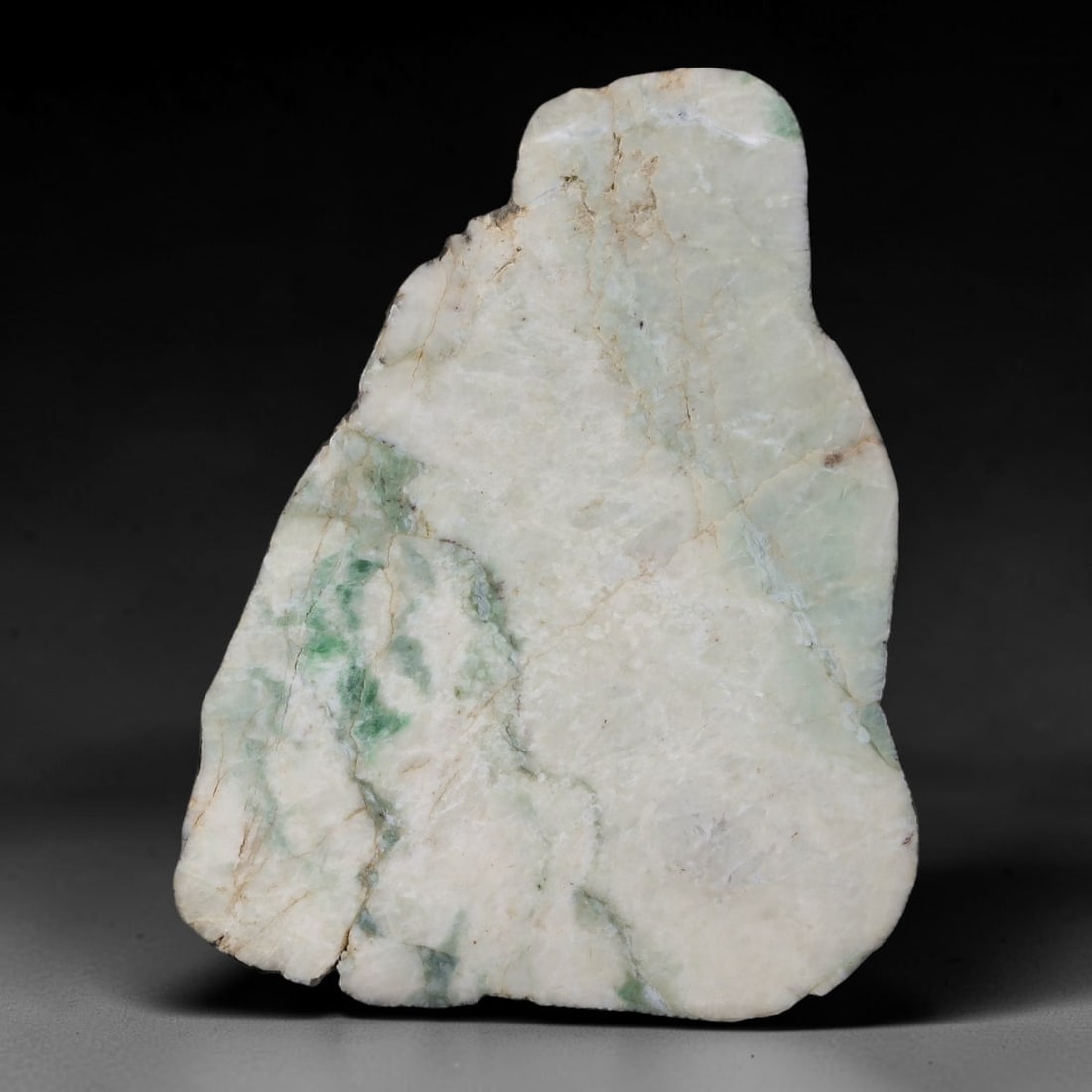 325ct Natural Type A Burmese Jadeite Jade Sliced Rough, 57AZ: This specimen is a sliced rough block of natural Type A Burmese jadeite jade. The interior displays natural colour zoning with visible mineral veining and crystalline patterns typical of unprocessed j