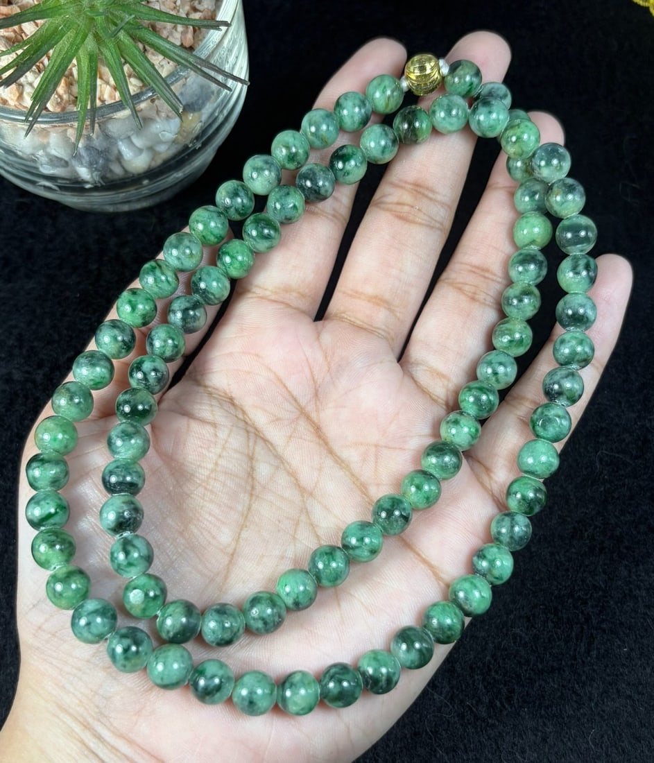 Natural Burmese Type A Dark Floating Green Jadeite Beaded Necklace, 23YM: Hand-strung natural Burmese Type A jadeite round beads with rich deep green mossy floating inclusions throughout each polished bead. Every sphere features natural marbled green veining against a pale 