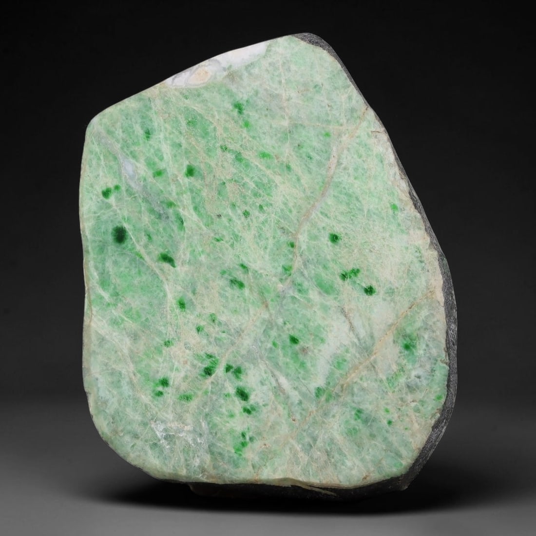 425ct Natural Type A Burmese Jadeite Jade Sliced Rough, 35AZ: This specimen is a sliced rough block of natural Type A Burmese jadeite jade. The interior displays natural colour zoning with visible mineral veining and crystalline patterns typical of unprocessed j