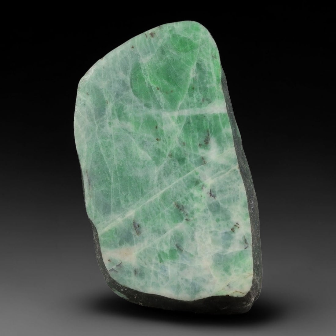 219ct Natural Type A Burmese Jadeite Jade Sliced Rough, 2YN: This specimen is a sliced rough block of natural Type A Burmese jadeite jade. The interior displays natural colour zoning with visible mineral veining and crystalline patterns typical of unprocessed j