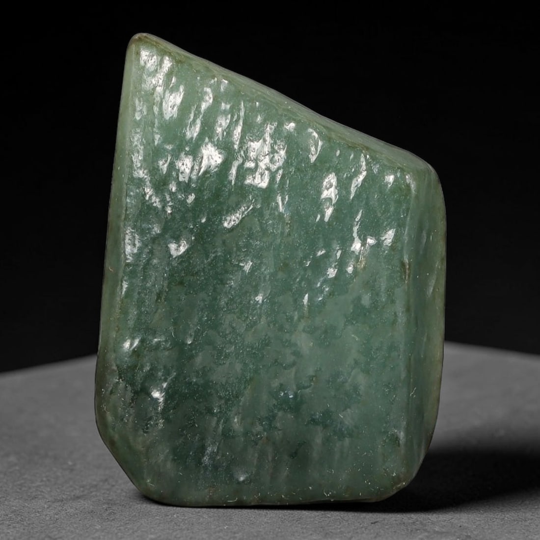 61ct Natural Type A Burmese Jadeite Jade Polished Sliced Rough, 24YN: This specimen is a sliced rough block of natural Type A Burmese jadeite jade. The interior displays natural colour zoning with visible mineral veining and crystalline patterns typical of unprocessed j