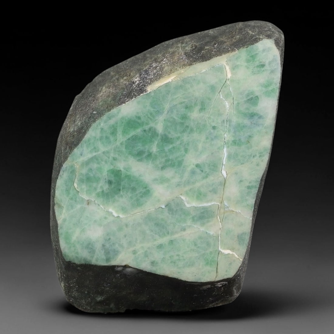 156ct Natural Type A Burmese Jadeite Jade Sliced Rough, 89YN: This specimen is a sliced rough block of natural Type A Burmese jadeite jade. The interior displays natural colour zoning with visible mineral veining and crystalline patterns typical of unprocessed j