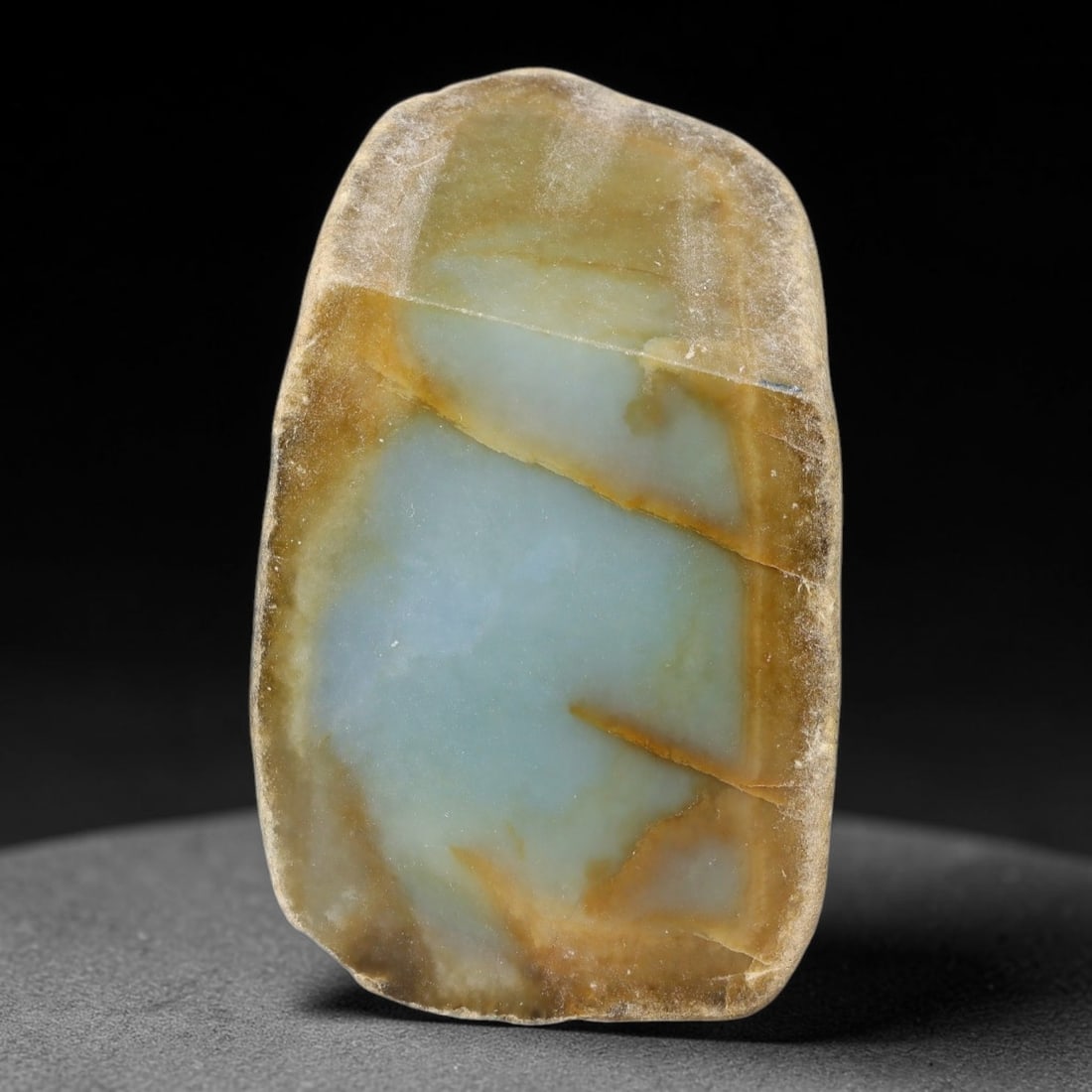 540ct Natural Type A Burmese Brown Rim Pale Blue Jadeite Jade Sliced Rough, 51YN: This specimen is a natural sliced rough pebble of untreated Type A Burmese jadeite, retaining complete weathered tan-brown outer rind framing its polished interior face displaying smooth semi-transluc