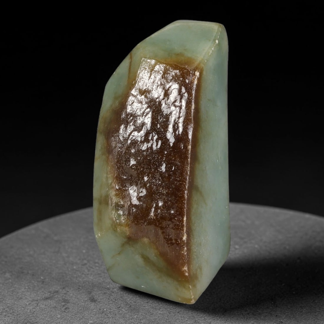 268ct Natural Type A Burmese Jadeite Jade Polished Sliced Rough, 30YN: This specimen is a sliced rough block of natural Type A Burmese jadeite jade. The interior displays natural colour zoning with visible mineral veining and crystalline patterns typical of unprocessed j