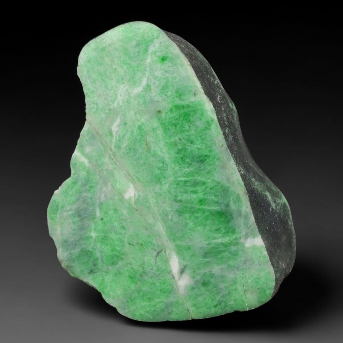 157ct Natural Type A Burmese Jadeite Jade Sliced Rough, 78YN: This specimen is a sliced rough block of natural Type A Burmese jadeite jade. The interior displays natural colour zoning with visible mineral veining and crystalline patterns typical of unprocessed j