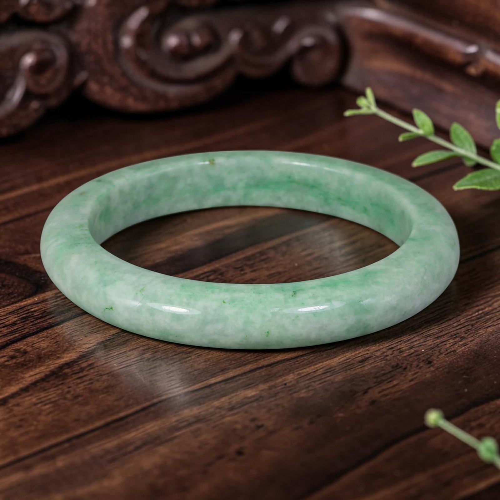 Natural Burmese Type A Light Green Jadeite Jade Bangle Bracelet, 72AZ: Crafted from natural Burmese Type A jadeite jade, this large bangle features soft flowing green streaks spread over a pale milky base, forming a gentle Moss in Snow pattern. The stone has a smooth hig