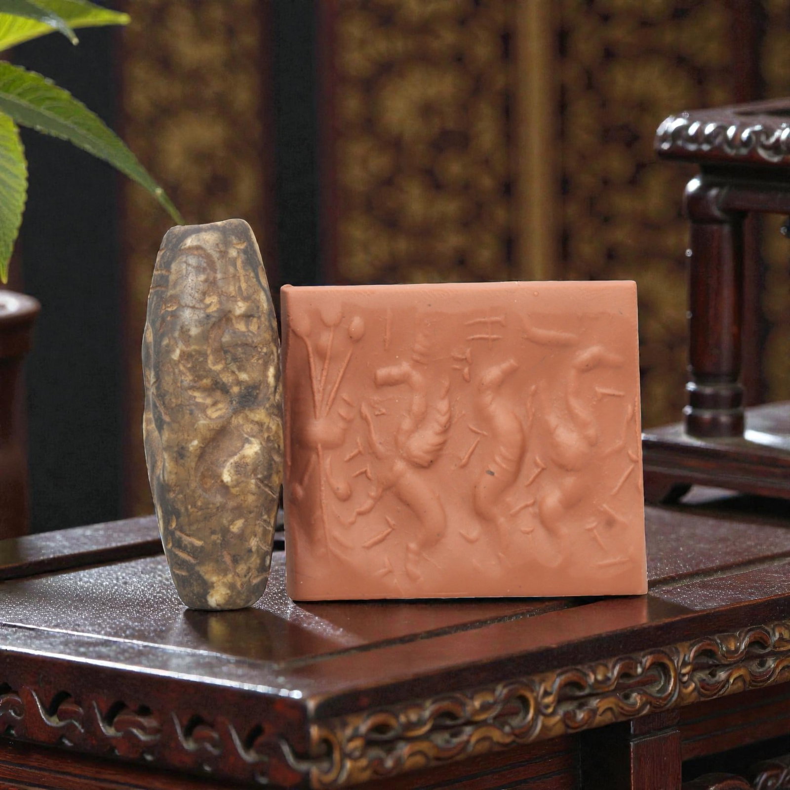 Ancient Steatite Cylinder Seal - Mesopotamian Mythological Carving, 82ZR: Crafted from dense steatite, this ancient Mesopotamian cylinder seal displays precise hand-carved iconography featuring a winged anthropomorphic figure and animal motifs, executed in the linear relief
