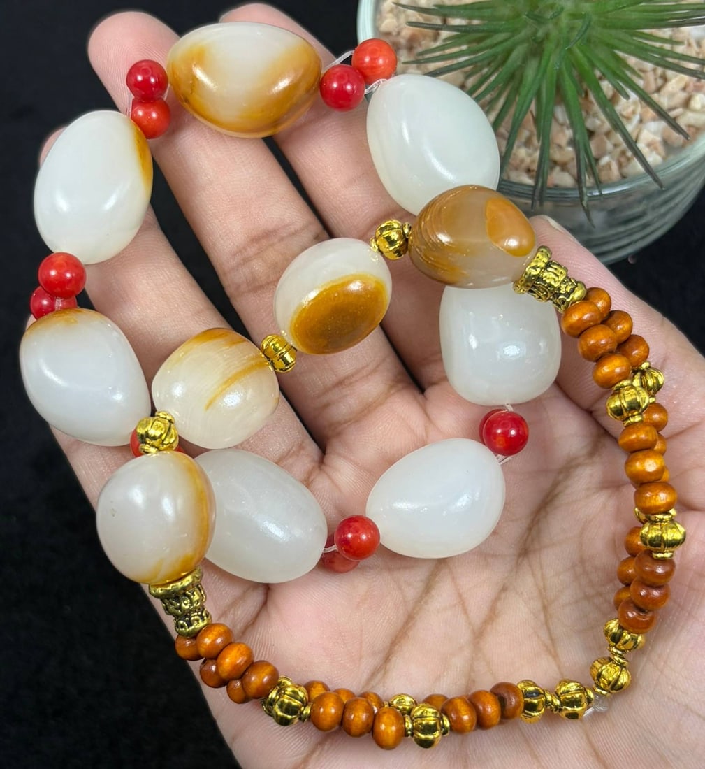 Lot of 2 Natural White Hetian Nephrite Seed Jade Bracelets, 10AS: Set of 2 hand-strung stretch bracelets made of polished natural white Hetian nephrite river seed jade pebbles, with the maximum oval jade bead size reaching 2.4cm. Smooth milky white nephrite features
