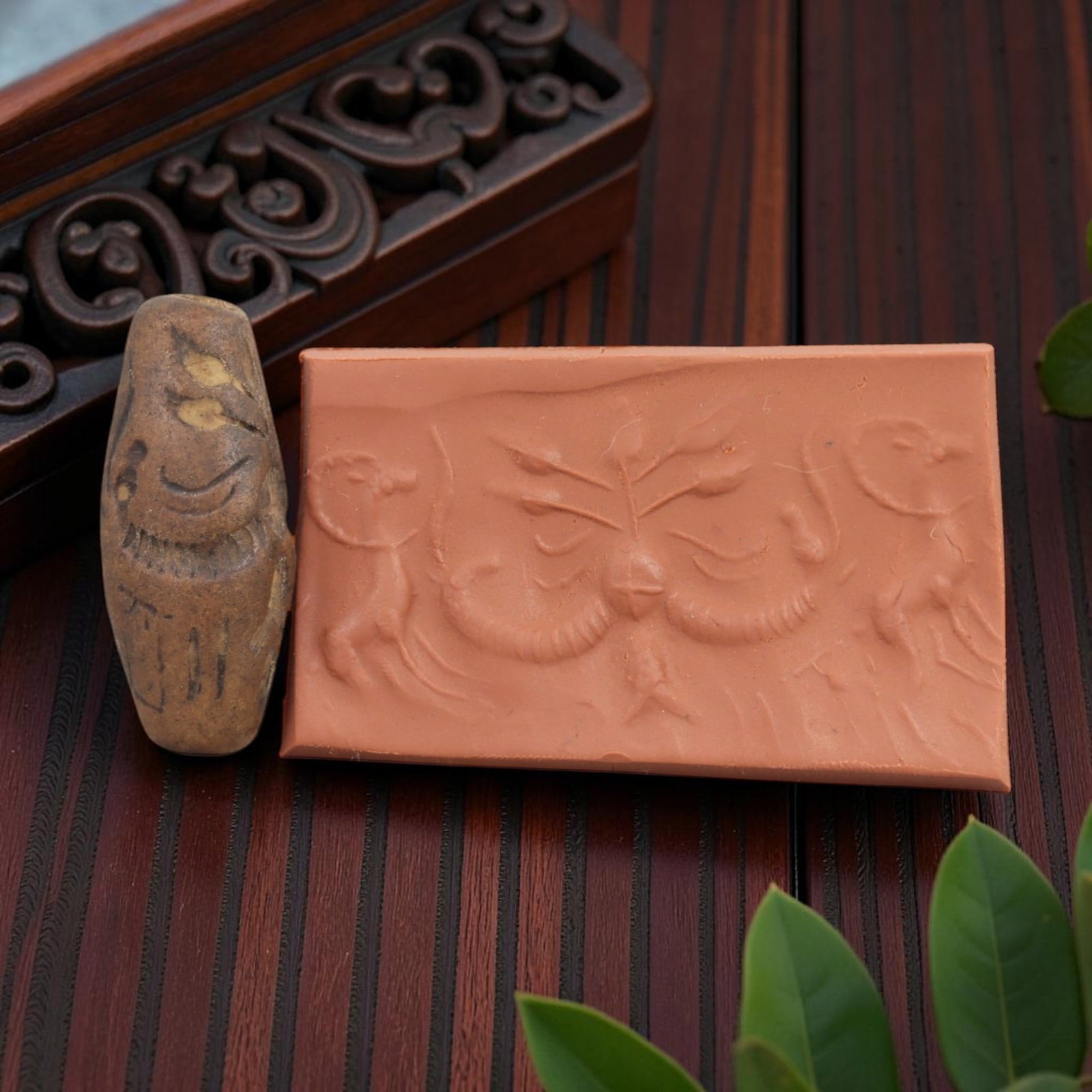Ancient Steatite Cylinder Seal - Mesopotamian Animal & Botanical Motif Scene, 59AN: Carved from dense steatite, this ancient Mesopotamian cylinder seal features a precise linear relief composition of leaping animal figures flanking a central symmetrical botanical motif, executed in t