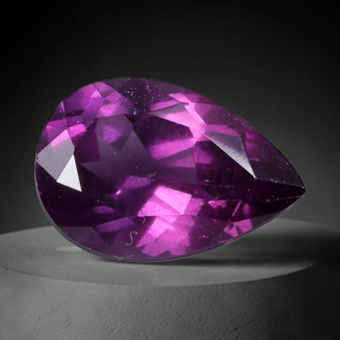 3.87 Carats Natural Rhodolite Garnet - Pear Faceted Loose Gemstone, 33XB: Natural pear-faceted rhodolite garnet gemstone, a premium pyrope-almandine garnet specimen. This stone exhibits a vivid, saturated deep purple-pink hue with exceptional brilliance, enhanced by a preci