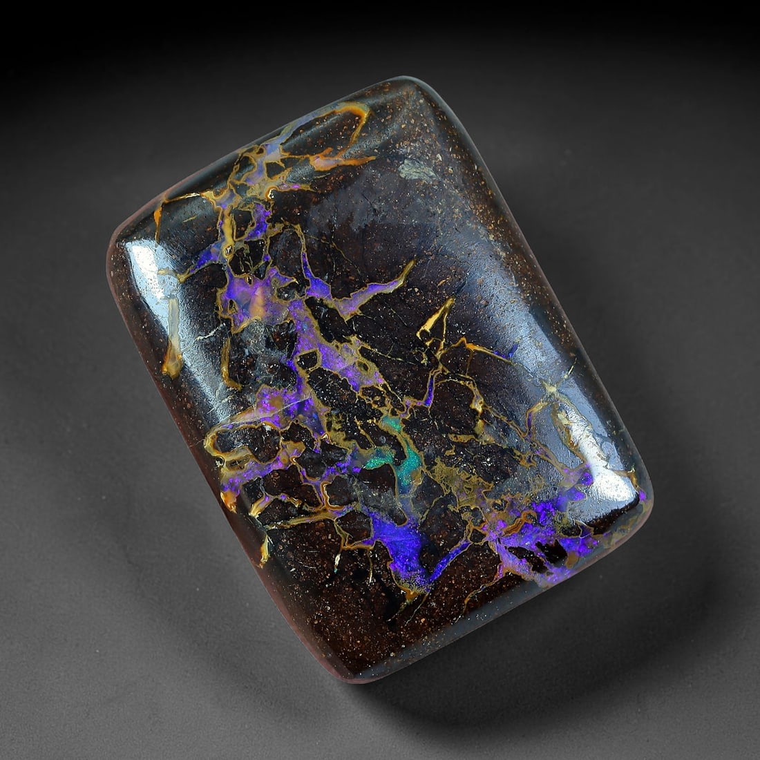 9.12ct Natural Australian Queensland Matrix Boulder Opal Cabochon, 21AV: Hand polished small rounded rectangular cushion cabochon crafted from natural Queensland matrix boulder opal, featuring dark speckled ironstone host matrix interwoven with intricate fractal opal veins