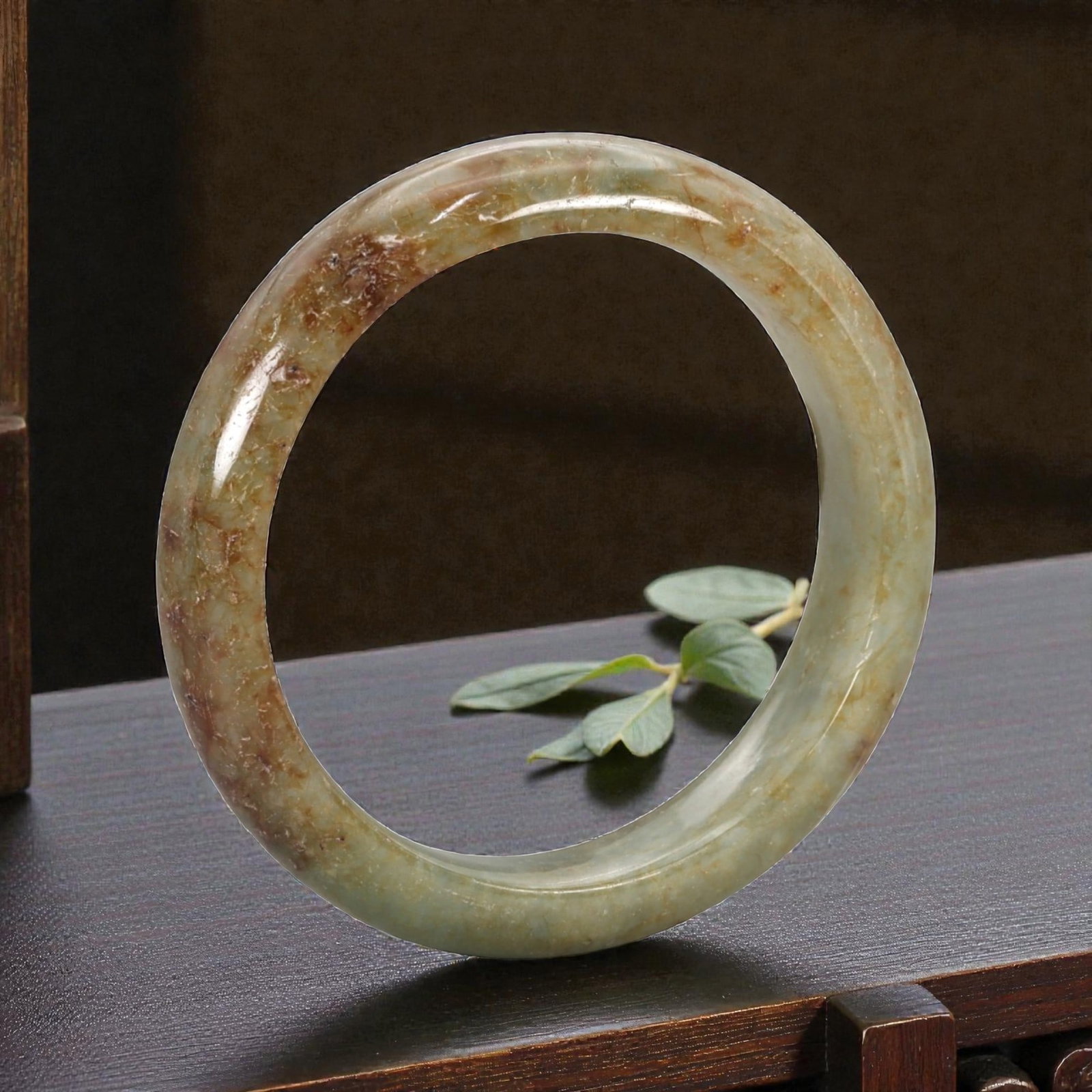 Natural Burmese Type A Jadeite Jade Bangle Bracelet, 20th Century, 98ZK: Carved from jadeite jade with a transitional palette of pale green at the base grading to rich russet and amber-hued inclusions concentrated on the upper portion, the bangle is formed as a continuous 
