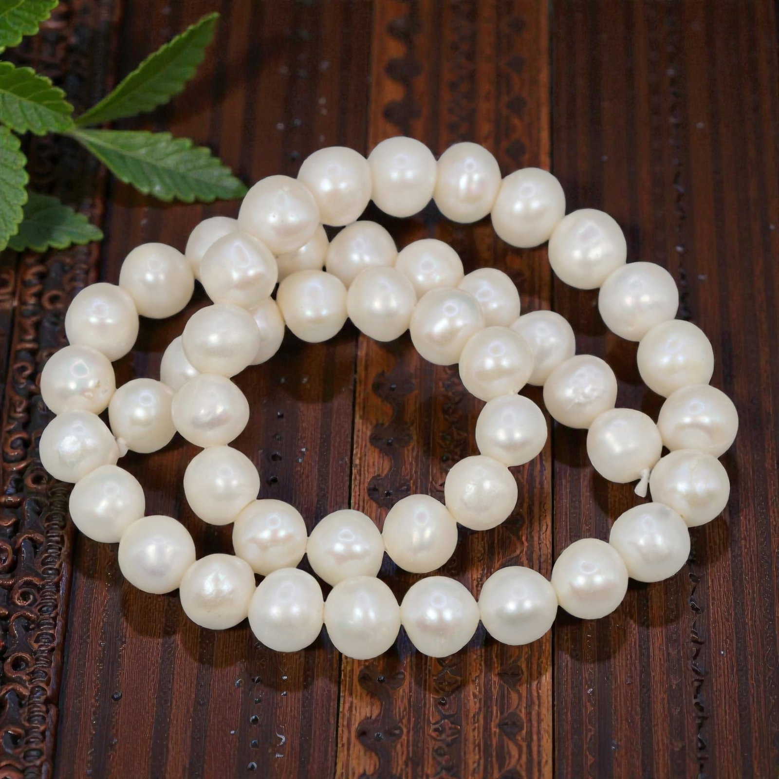 A Strand of Cultured Pearls, 20th Century, 78ZJ: Composed of uniformly sized, near-round cultured pearls with a creamy white body color and subtle pinkish overtones, the strand is strung in a single continuous line. Each pearl exhibits a soft, lustr