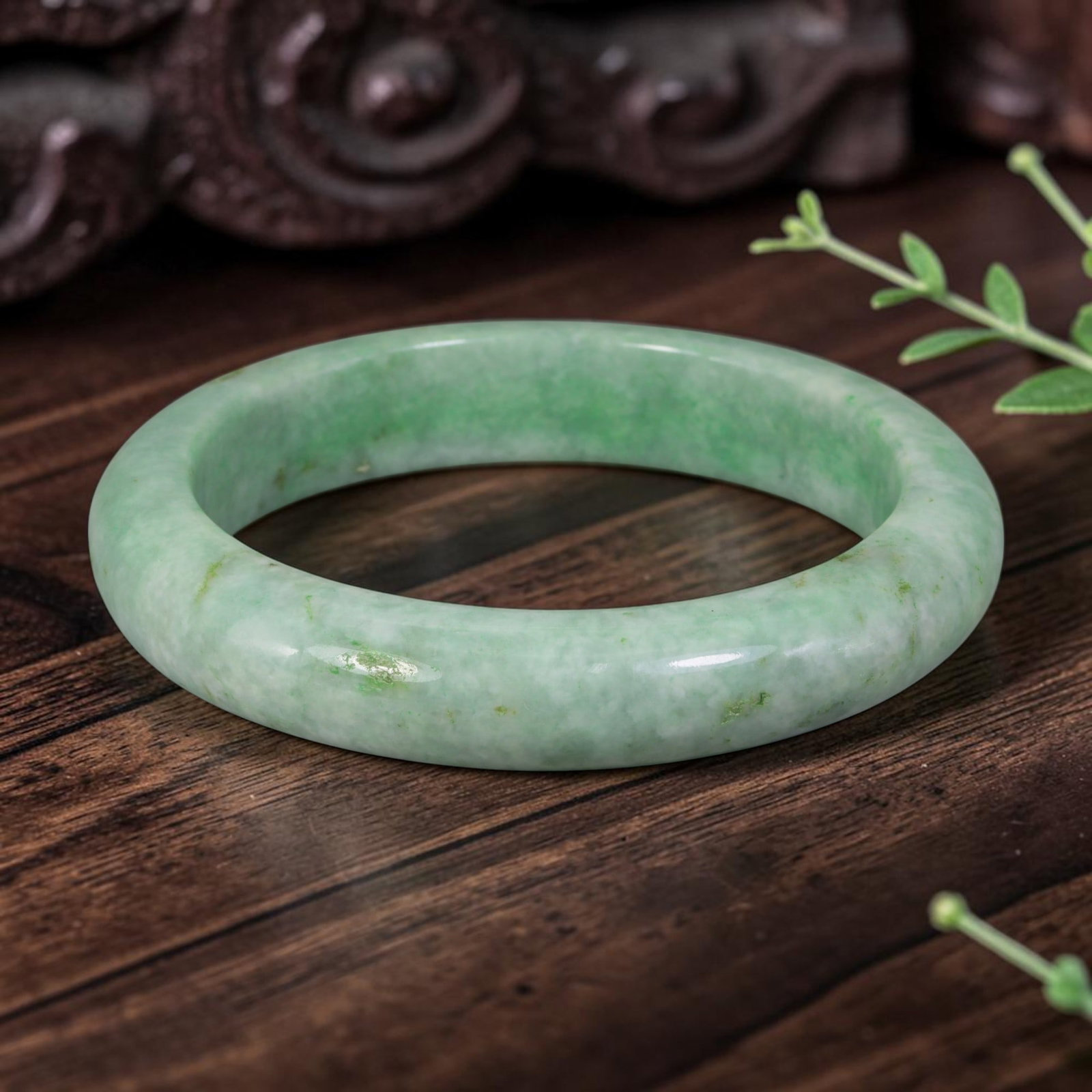 Natural Burmese Type A Light Green Jadeite Jade Bangle Bracelet, 73AZ: Crafted from natural Burmese Type A jadeite jade, this large-size bangle carries consistent pale apple green with scattered tiny green flecks across the milky base, forming a subtle Moss in Snow patte