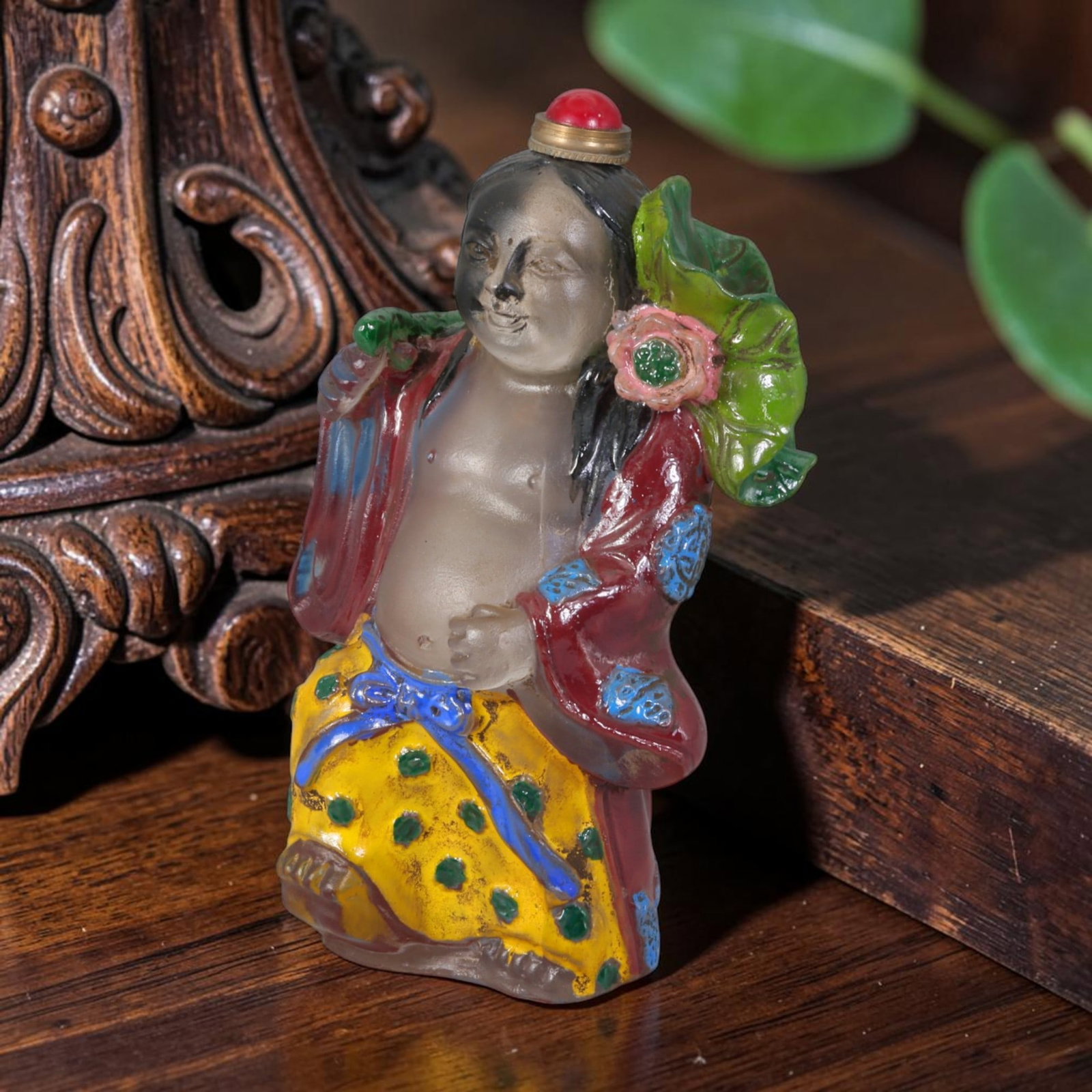Vintage Chinese Liuli Glass Snuff Bottle - Hand Painted He He Immortal Lotus Figurine Vessel, 60AS: This fully sculpted anthropomorphic snuff bottle is crafted from translucent frosted clear vintage Chinese liuli glass, shaped as a traditional He He Er immortal figure with soft smiling facial featur