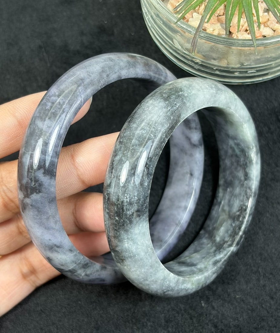 Lot of 2 Natural Burmese Type A Ink Lavender Jadeite Bangles, 52.3mm & 58.3mm Inner Diameter, 33AV: Two untreated authentic Type A jadeite bangles with inner diameters 52.3mm and 58.3mm, featuring moody grey-lavender base naturally swirled with dark black ink cloud veining, smooth wide polished band