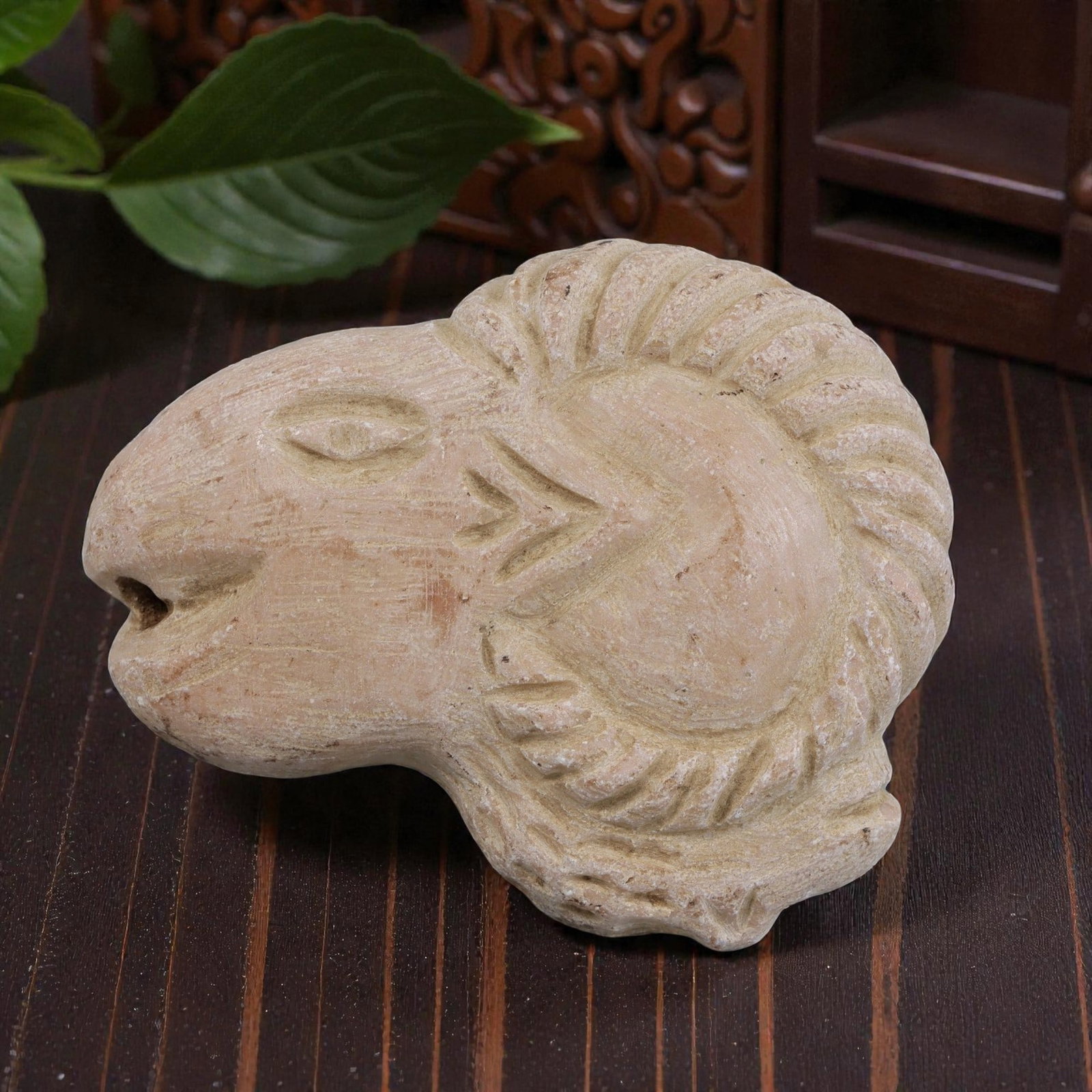 Antique Medieval Silk Road Carved Stone Ram Head, 90AN: Carved from light-colored stone with natural patination and surface wear, this artifact depicts a stylized ram's head. The figure features simplified incised details for the eye and facial features, w