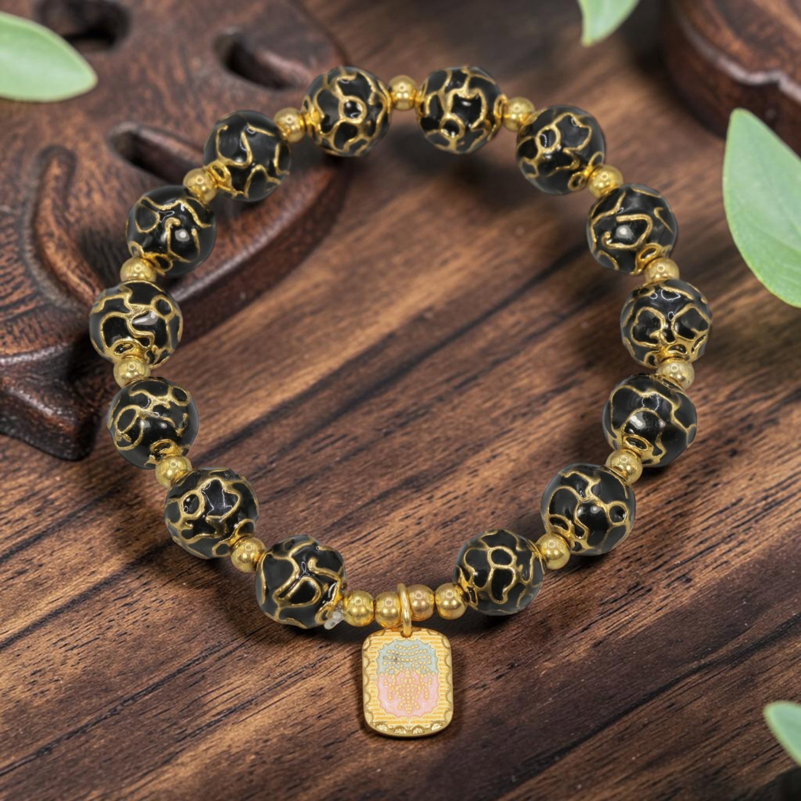 A Chinese Cloisonne Enamel Beaded Bracelet - Black Gold-Tone Decorative Charm, 49YJ: This modern Chinese-style bracelet features 10.36mm round cloisonne enamel beads in a deep black hue, each detailed with raised gold-tone cloud patterns. Small smooth gold-tone spacer beads separate t