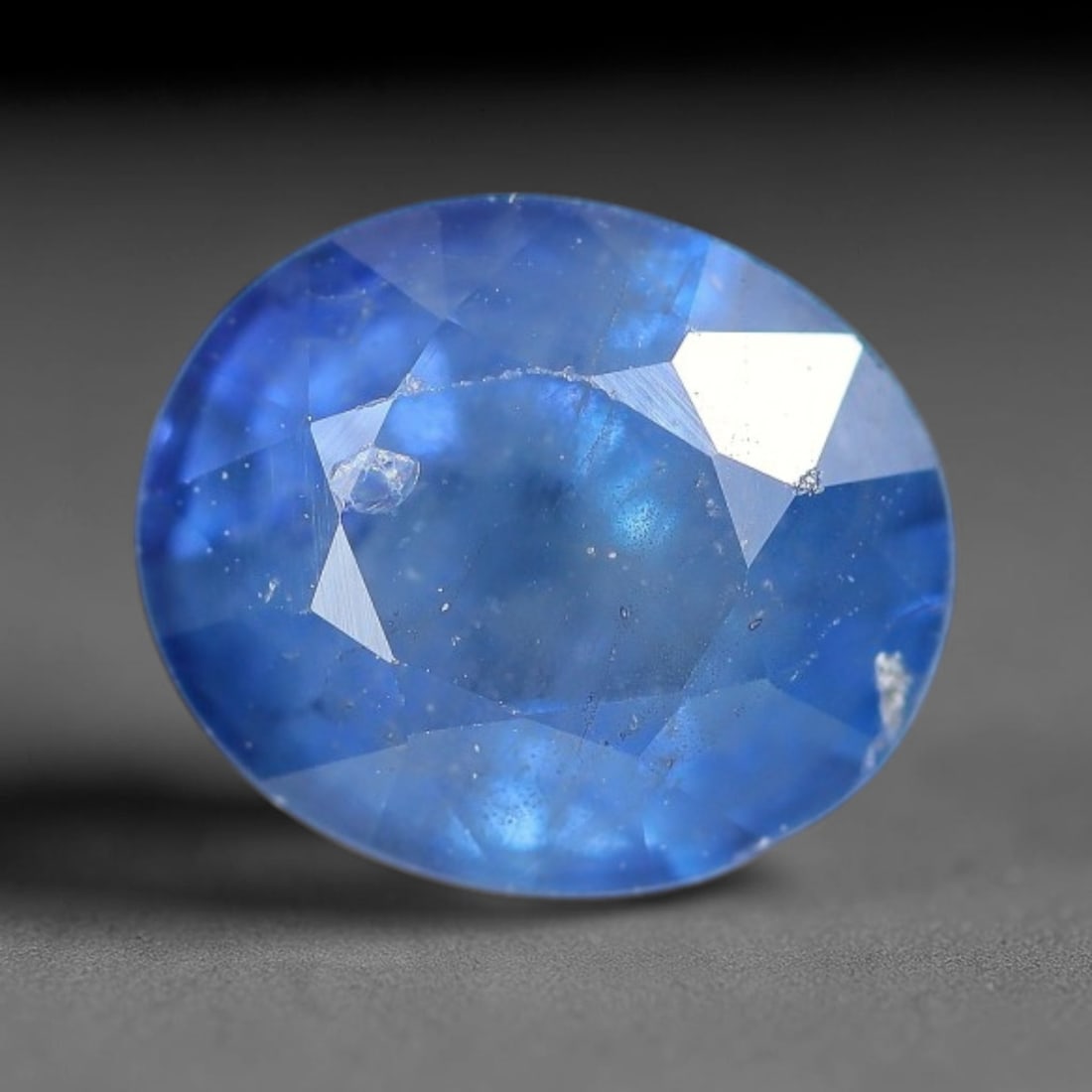 1.43 Carats Natural Royal Blue Oval Sapphire Gemstone, 2XZ: Come take a look at this sweet little natural sapphire all faceted and ready for setting work. It holds a rich, steady royal blue tone, deep and vivid just like a clear midday summer sky. This single 