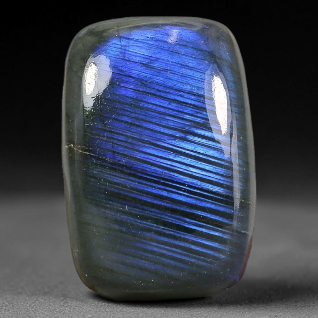 26.27 Carats Natural Vibrant Blue Flash Labradorite Rectangle Cabochon Gemstone, 13XZ: I've got a real nice parcel here to show you, this eye-catching polished labradorite cabochon packed with stunning linear blue schiller flash. This rounded rectangle cab measures 22.7x15.3x7.6mm and w