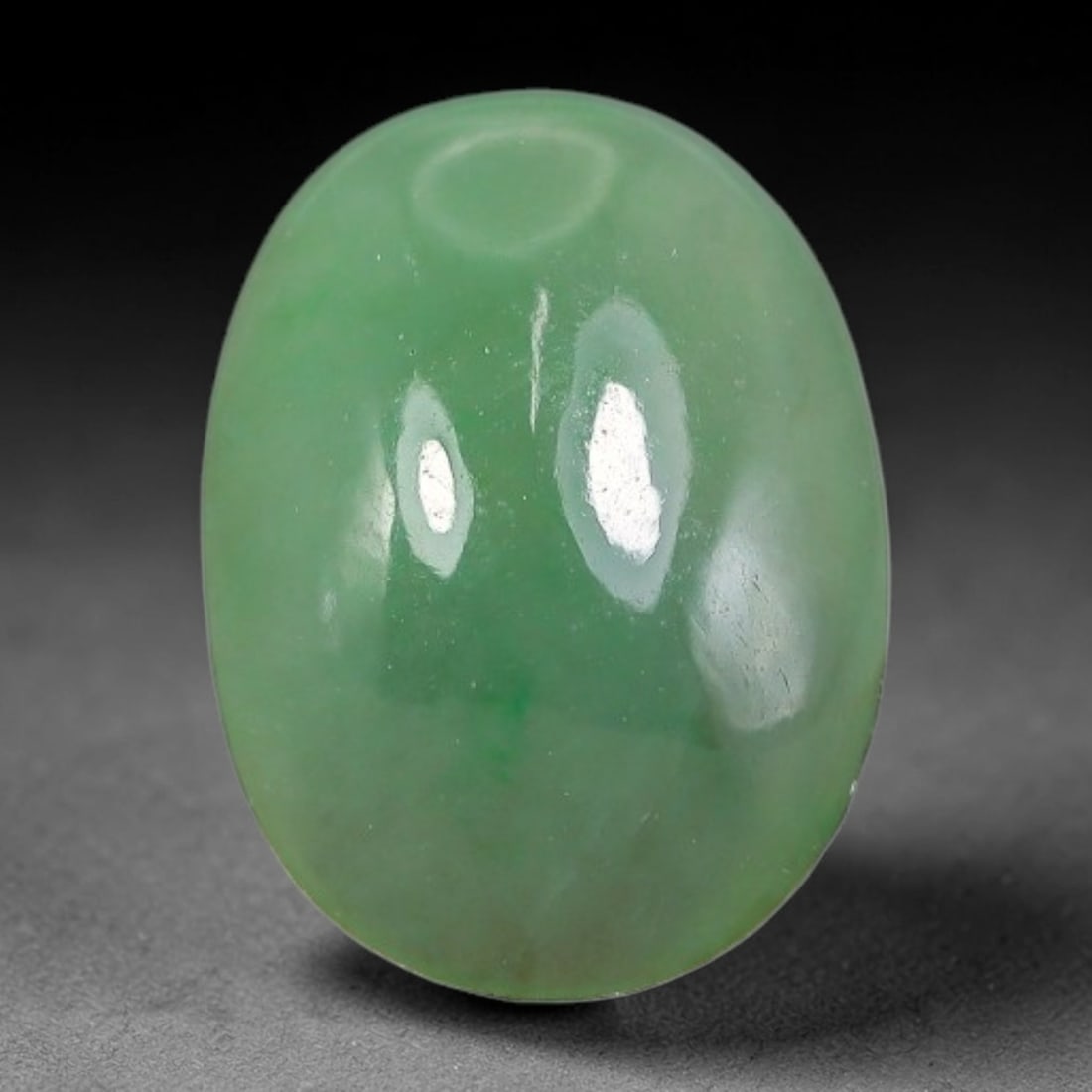 3.42ct Natural Burmese Type A Apple Green Jadeite Jade Cabochon, 72FA: This single loose natural Burmese Type A apple green jadeite jade cabochon, completely untreated, free of artificial dye, bleaching, or resin filling, preserving the original natural mineral crystal s