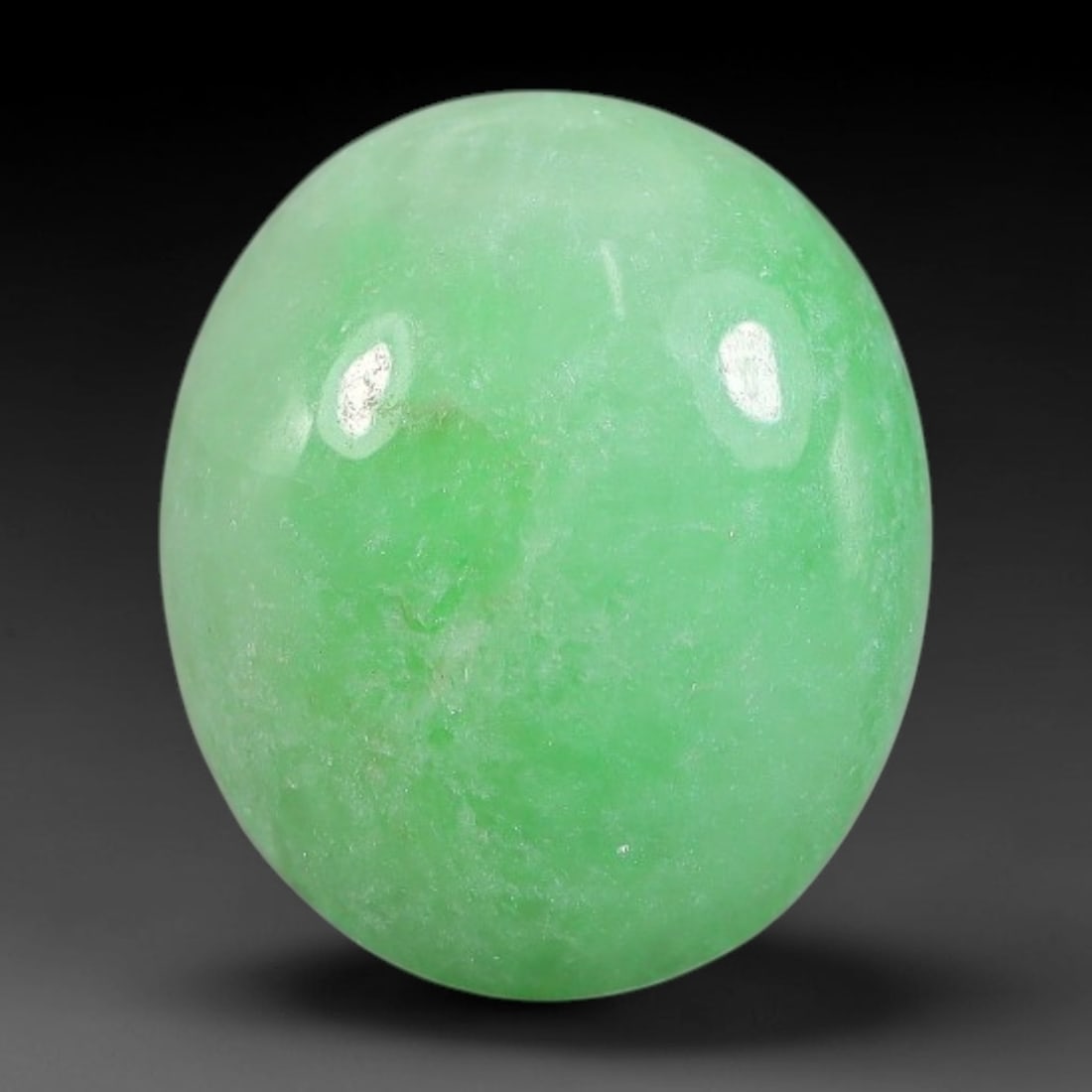 4.53ct Natural Burmese Type A Apple Green Jadeite Jade Cabochon, 75FA: This single loose natural Burmese Type A apple green jadeite jade cabochon, completely untreated, free of artificial dye, bleaching, or resin filling, preserving the original natural mineral crystal s