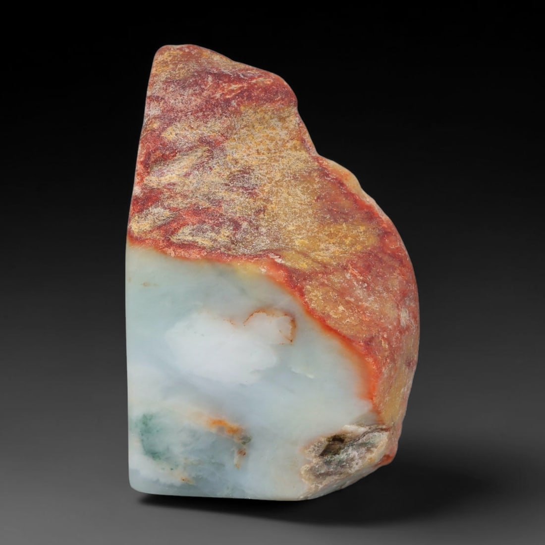 340ct Natural Type A Burmese Jadeite Jade Sliced Rough, 78YK: This specimen is a sliced rough block of natural Type A Burmese jadeite jade. The interior displays natural colour zoning with visible mineral veining and crystalline patterns typical of unprocessed j