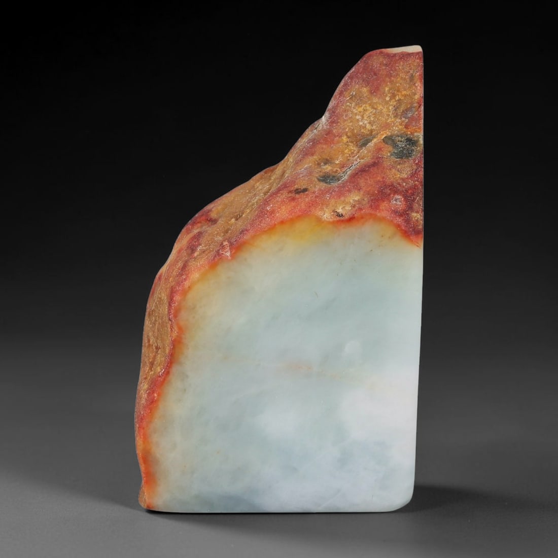 400ct Natural Type A Burmese Jadeite Jade Sliced Rough, 79YK: This specimen is a sliced rough block of natural Type A Burmese jadeite jade. The interior displays natural colour zoning with visible mineral veining and crystalline patterns typical of unprocessed j