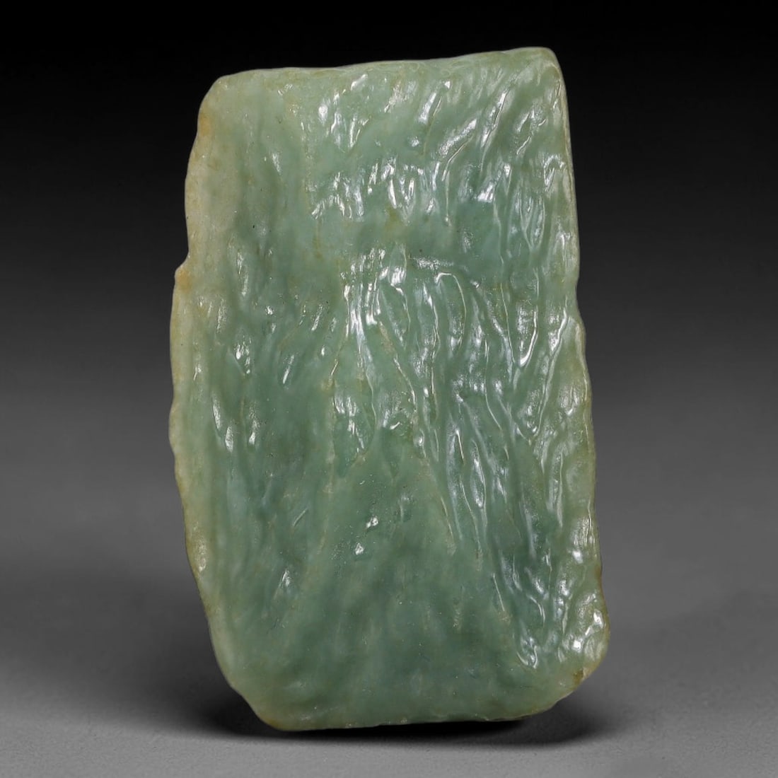 148ct Natural Type A Burmese Jadeite Jade Polished Sliced Rough, 23YN: This specimen is a sliced rough block of natural Type A Burmese jadeite jade. The interior displays natural colour zoning with visible mineral veining and crystalline patterns typical of unprocessed j