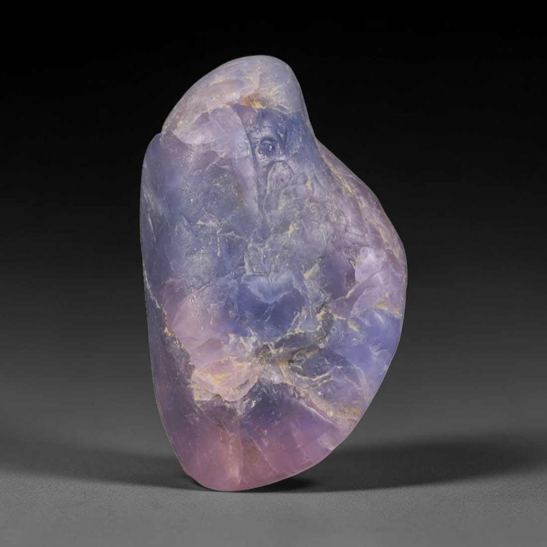 17ct Natural Unheated Sri Lankan Purplish Blue Sapphire Rough, 80YQ: This natural corundum rough is an unheated purplish blue sapphire sourced from Sri Lankan alluvial gem deposits, featuring an irregular natural native form with residual pale yellow-brown mineral matr