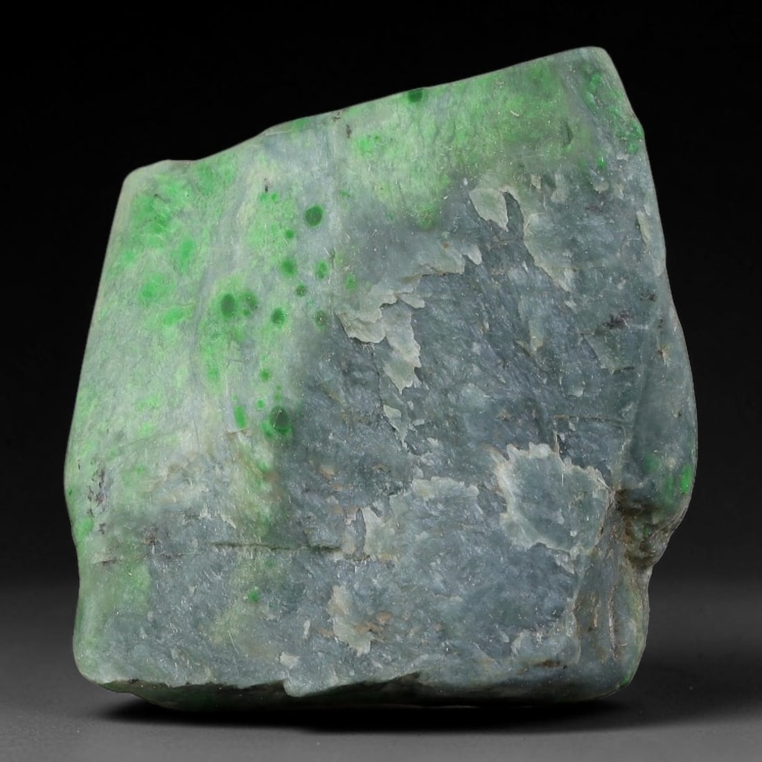 95ct Natural Type A Burmese Jadeite Jade Sliced Rough, 69YN: This specimen is a sliced rough block of natural Type A Burmese jadeite jade. The interior displays natural colour zoning with visible mineral veining and crystalline patterns typical of unprocessed j