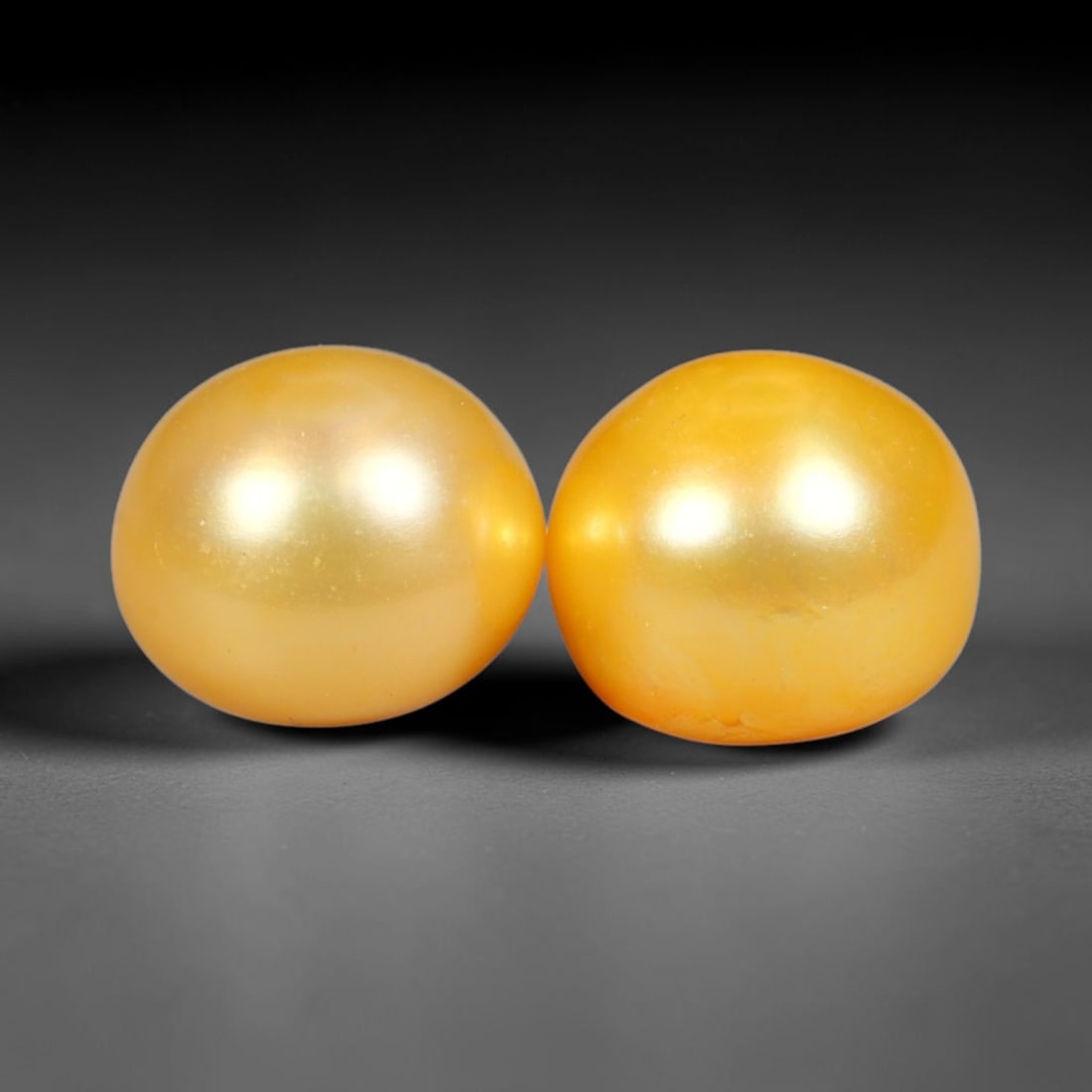 8.60ct Natural Warm Golden Yellow Orient Freshwater Half Round Pearl Pair, 49XZ: Matching pair of color-enhanced freshwater half-round pearls measuring 8.9x7.1mm each, crafted with smooth domed silhouettes ideal for earring mounting. The pearls feature a rich saturated warm golden