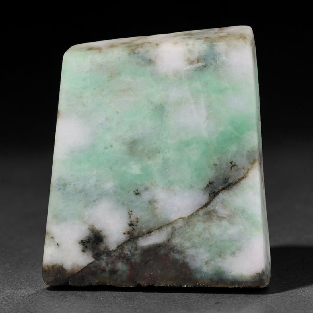 315ct Natural Type A Burmese Jadeite Jade Sliced Rough, 70YK: This specimen is a sliced rough block of natural Type A Burmese jadeite jade. The interior displays natural colour zoning with visible mineral veining and crystalline patterns typical of unprocessed j