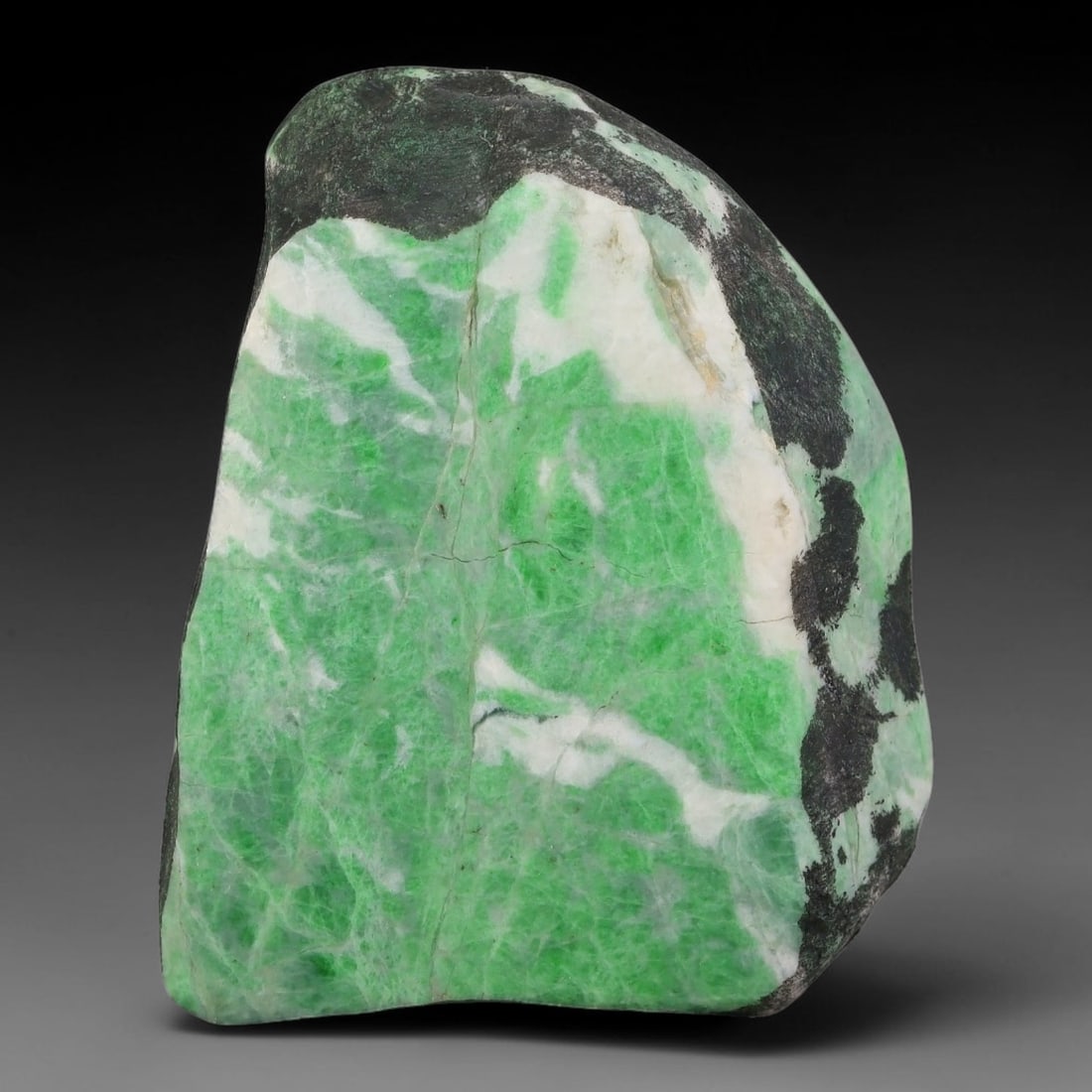 330ct Natural Type A Burmese Jadeite Jade Sliced Rough, 94YN: This specimen is a sliced rough block of natural Type A Burmese jadeite jade. The interior displays natural colour zoning with visible mineral veining and crystalline patterns typical of unprocessed j