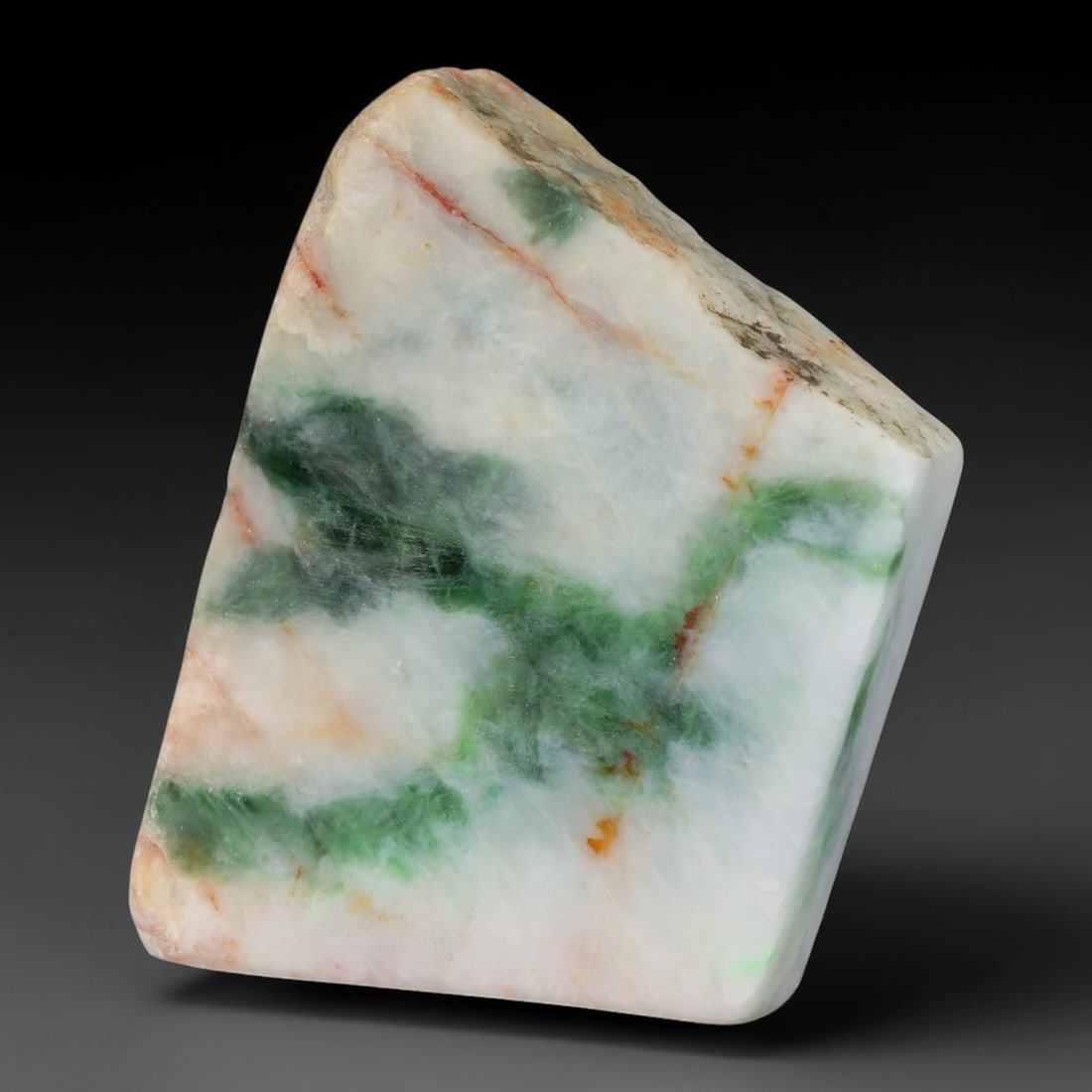 280ct Natural Type A Burmese Jadeite Jade Sliced Rough, 38YK: This specimen is a sliced rough block of natural Type A Burmese jadeite jade. The interior displays natural colour zoning with visible mineral veining and crystalline patterns typical of unprocessed j