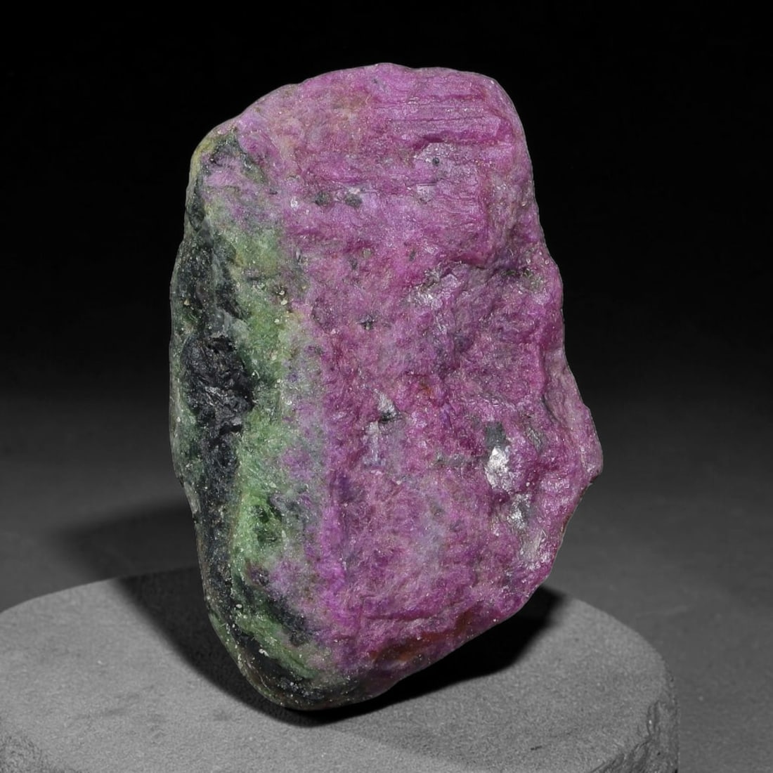 71ct Natural Tanzanian Ruby Zoisite Raw Rough Specimen Mineral Stone, 12YQ: This unpolished mineral rough is natural ruby zoisite sourced from Tanzania, exhibiting distinct banded mineral segregation of vibrant green zoisite, magenta ruby crystals, and dark hornblende inclusi
