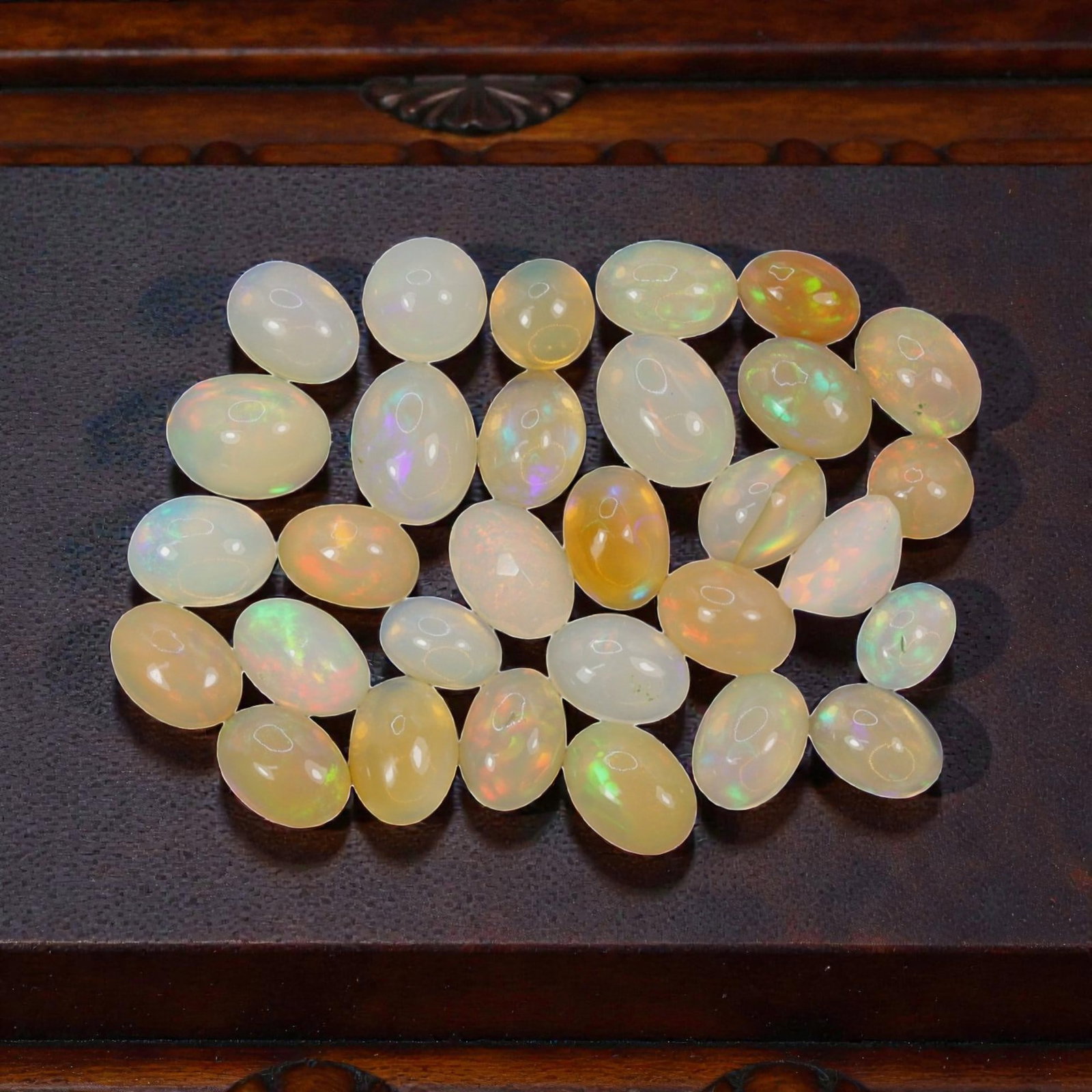15.47 Carats Welo Opal Cabochon Parcel - Natural Ethiopian Stones, 52XA: This luminous collection of Welo opals features a rich palette of warm and cool translucent body tones, from milky white and soft cream to honey and golden amber, each adorned with vivid, shifting col