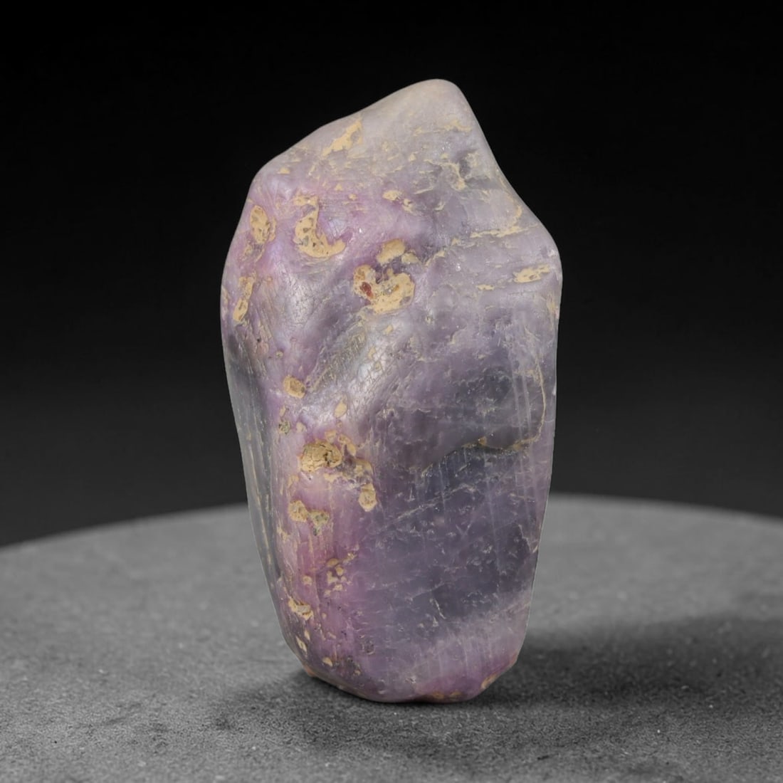 46ct Natural Unheated Sri Lankan Purplish Blue Sapphire Rough, 28YQ: This natural corundum rough is an unheated purplish blue sapphire sourced from Sri Lankan alluvial gem deposits, featuring an irregular natural native form with residual pale yellow-brown mineral matr