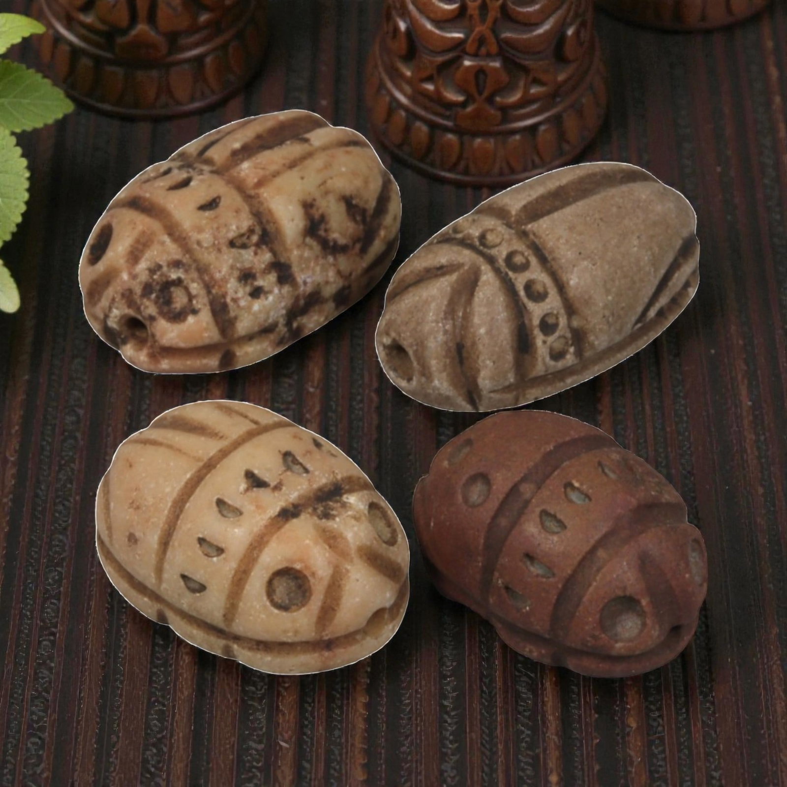 Lot of 4 Natural Coptic Egyptian Multi-Stone Scarab Amulets, Circa Roman to Coptic Era, 94WT: A group of four scarab amulets carved from various stones, including light beige and reddish-brown examples. Each is formed as a stylized scarab beetle with incised carapace details, including lines, 