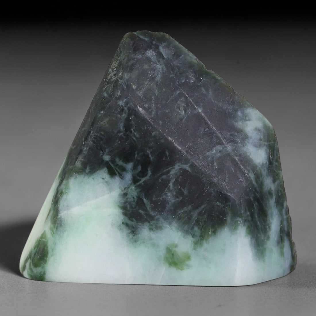 147ct Natural Type A Burmese Jadeite Jade Sliced Rough, 32YK: This specimen is a sliced rough block of natural Type A Burmese jadeite jade. The interior displays natural colour zoning with visible mineral veining and crystalline patterns typical of unprocessed j