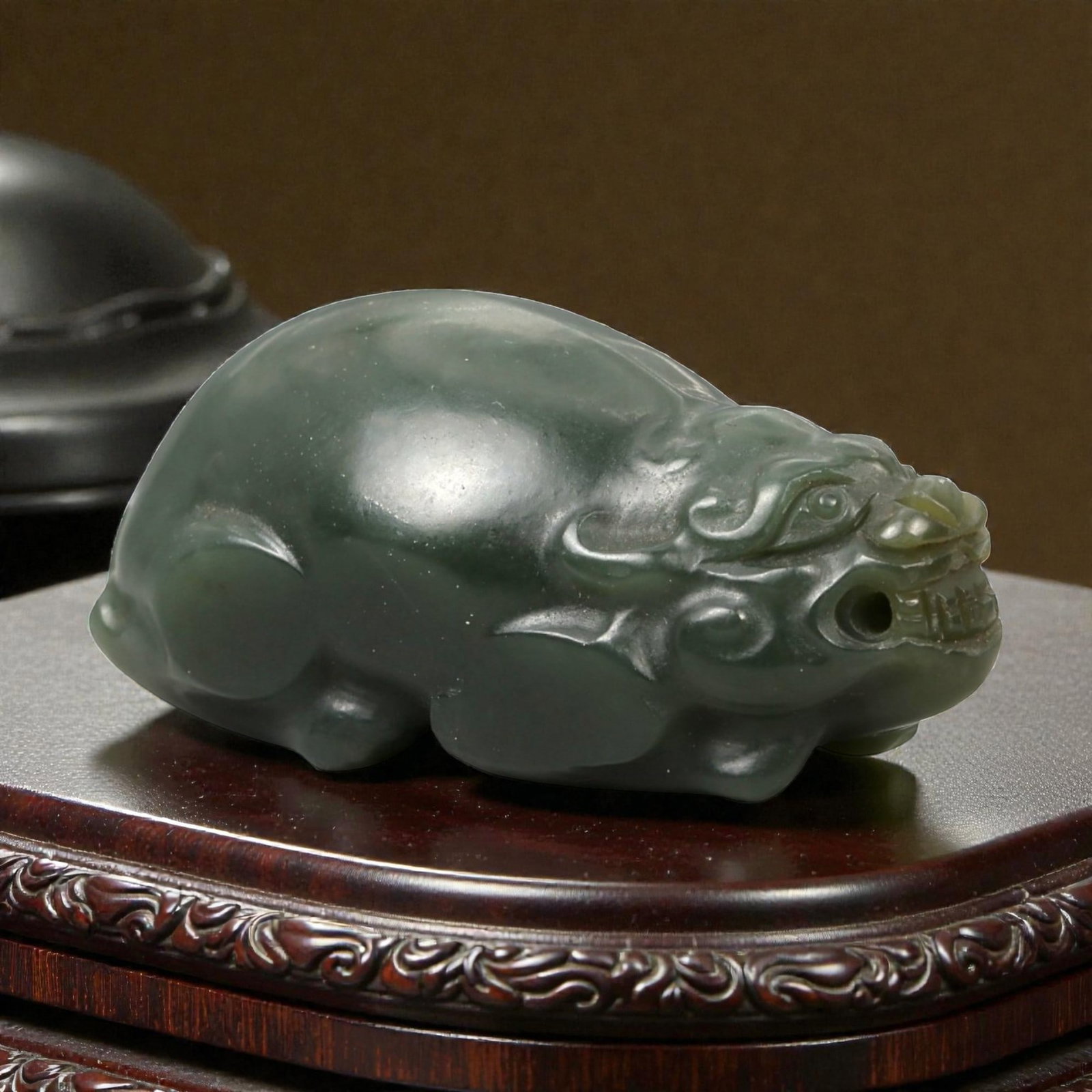 Chinese Jade Pixiu Beast - Carved Animal Figurine 4.2cm, 95ZC: Carved from green jade with areas of soft translucency and natural tonal variation, this compact sculptural figure depicts a pixiu rendered in a recumbent posture. The carving is worked fully in the r