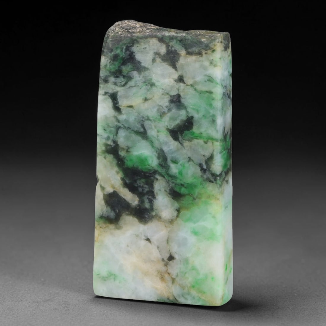 330ct Natural Type A Burmese Jadeite Jade Sliced Rough, 40YK: This specimen is a sliced rough block of natural Type A Burmese jadeite jade. The interior displays natural colour zoning with visible mineral veining and crystalline patterns typical of unprocessed j