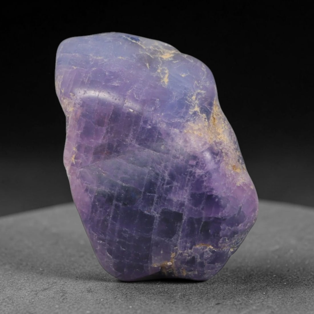 29ct Natural Unheated Sri Lankan Purplish Blue Sapphire Rough, 82YQ: This natural corundum rough is an unheated purplish blue sapphire sourced from Sri Lankan alluvial gem deposits, featuring an irregular natural native form with residual pale yellow-brown mineral matr