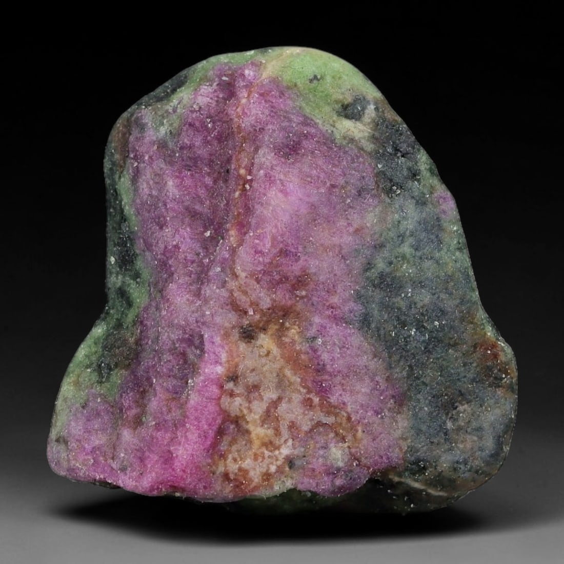 76ct Natural Tanzanian Ruby Zoisite Raw Rough Specimen Mineral Stone, 6YQ: This unpolished mineral rough is natural ruby zoisite sourced from Tanzania, exhibiting distinct banded mineral segregation of vibrant green zoisite, magenta ruby crystals, and dark hornblende inclusi