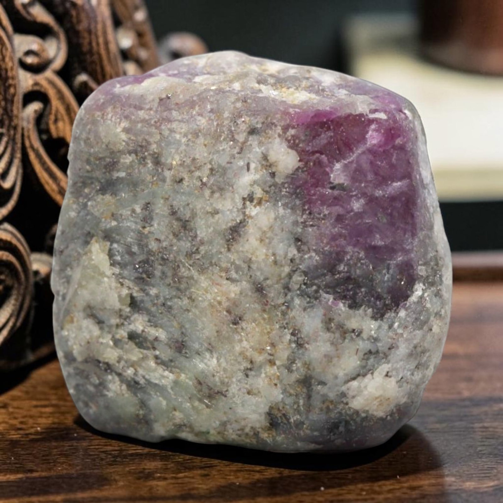 29.68ct Natural Mauritania Ruby Rough (Unheated), 63XE: This unheated Mauritania ruby rough is a captivating natural crystal specimen, featuring vivid magenta-purple ruby formations embedded in a contrasting greyish matrix. The stone's rugged, unpolished s