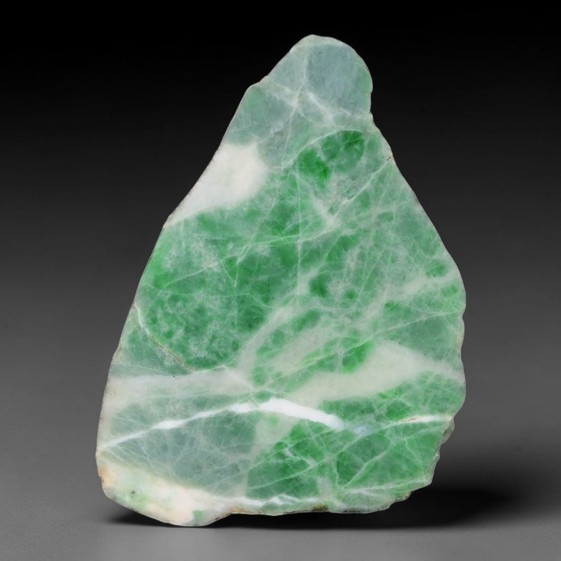 163ct Natural Type A Burmese Jadeite Jade Sliced Rough, 73YN: This specimen is a sliced rough block of natural Type A Burmese jadeite jade. The interior displays natural colour zoning with visible mineral veining and crystalline patterns typical of unprocessed j