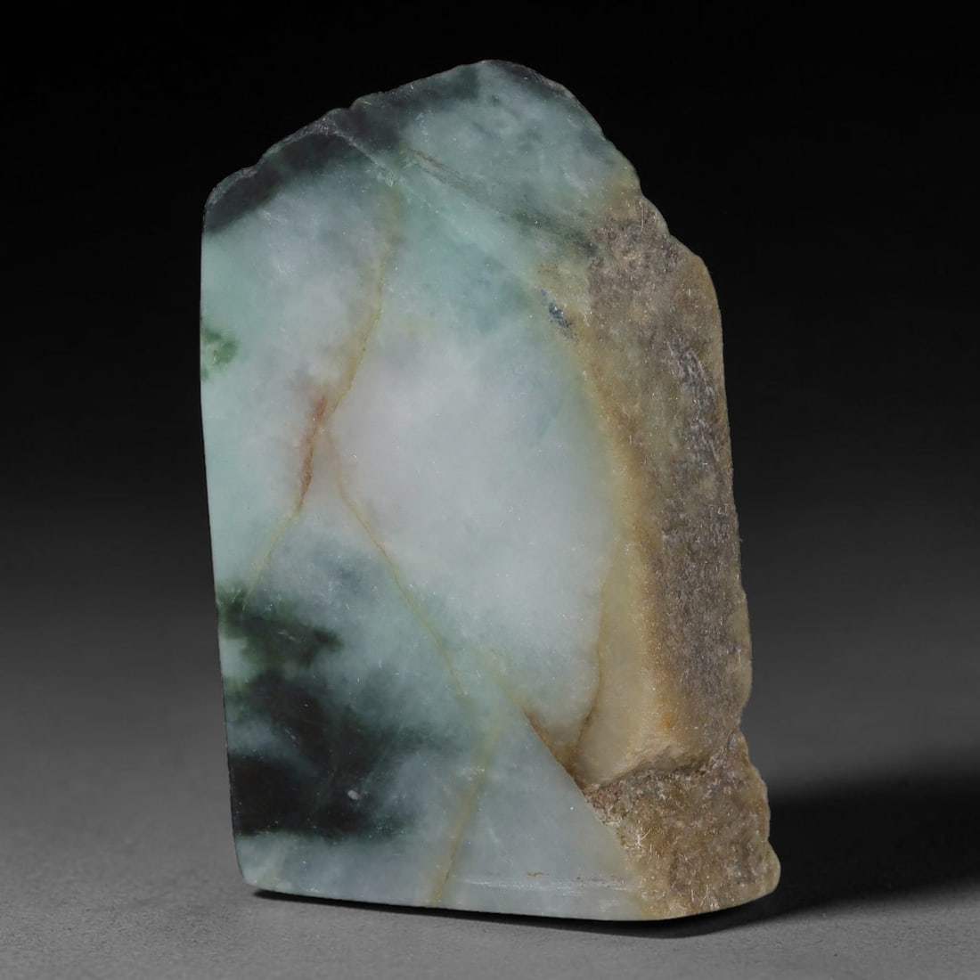 244ct Natural Type A Burmese Jadeite Jade Sliced Rough, 33YK: This specimen is a sliced rough block of natural Type A Burmese jadeite jade. The interior displays natural colour zoning with visible mineral veining and crystalline patterns typical of unprocessed j